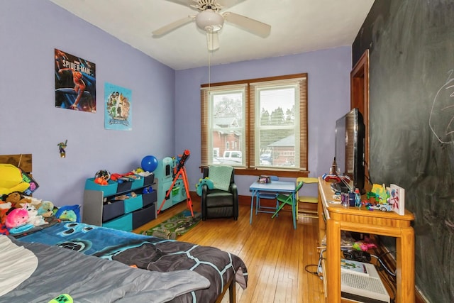 bedroom featuring ceiling fan and wood-type flooring