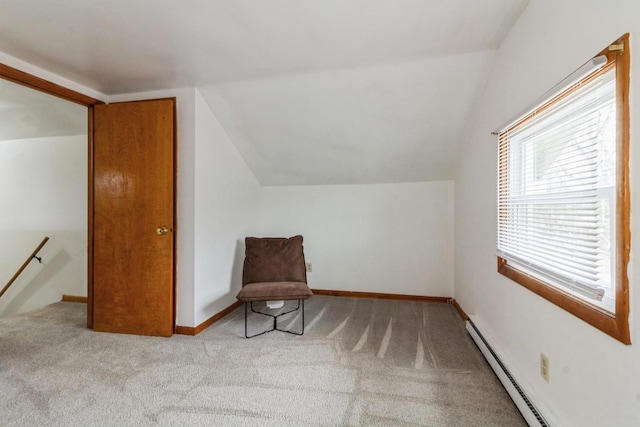 living area featuring carpet floors, a baseboard radiator, lofted ceiling, an upstairs landing, and baseboards