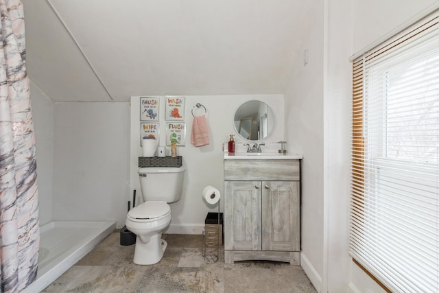 full bathroom with baseboards, toilet, vaulted ceiling, vanity, and a shower stall