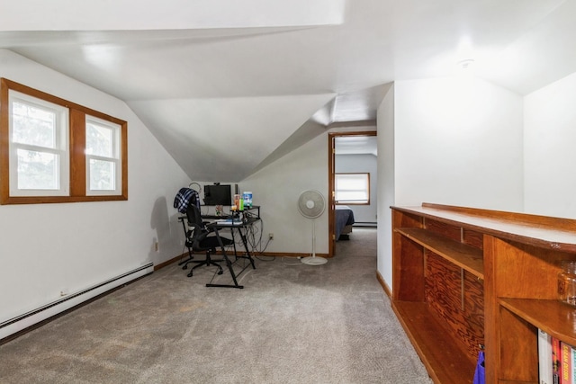 office area featuring a baseboard heating unit, vaulted ceiling, and carpet flooring