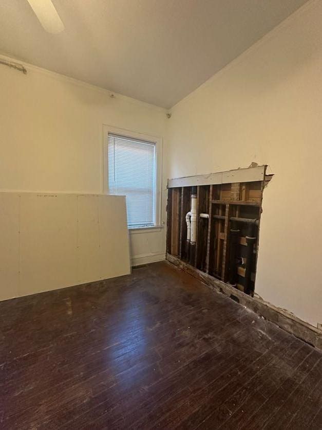 unfurnished living room featuring dark wood-type flooring