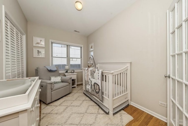 bedroom with light hardwood / wood-style flooring