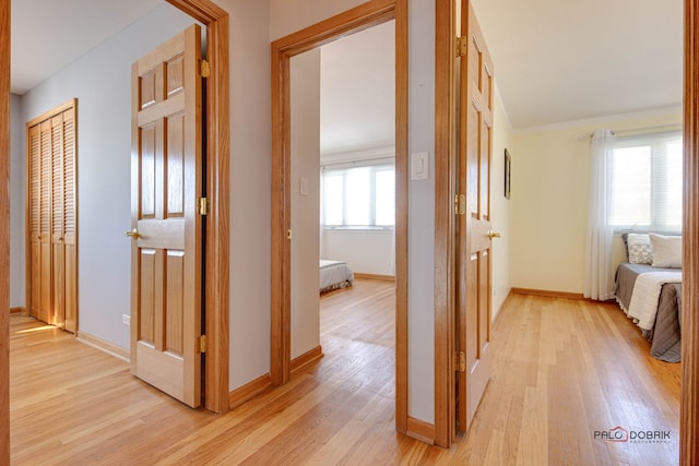 hall with light hardwood / wood-style flooring