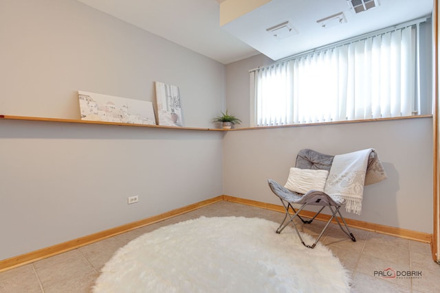 living area featuring light tile patterned floors