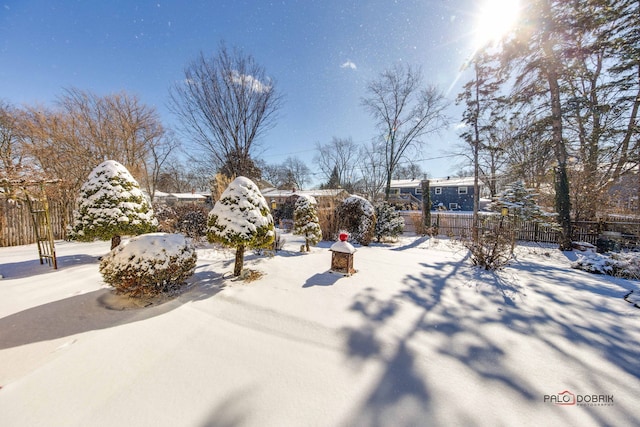 view of yard layered in snow