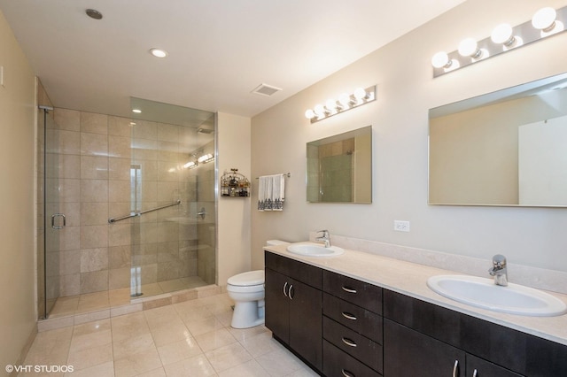 bathroom featuring toilet, a shower with door, tile patterned flooring, and vanity
