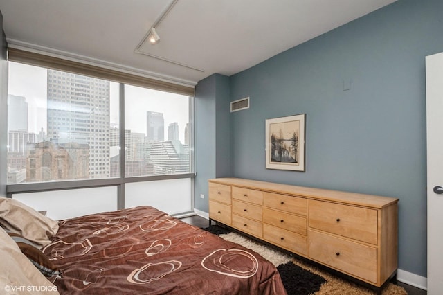 bedroom featuring track lighting