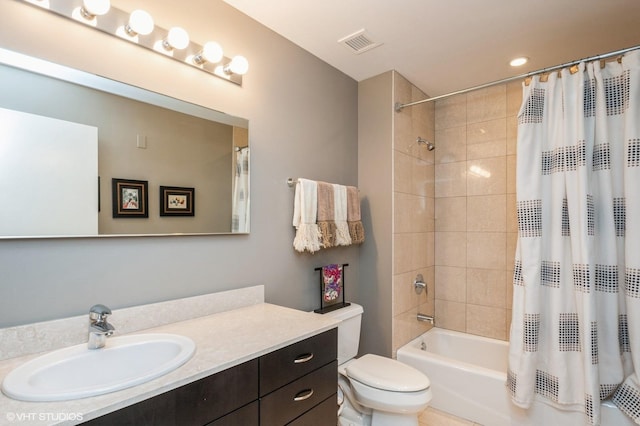 full bathroom featuring vanity, toilet, and shower / bath combo with shower curtain