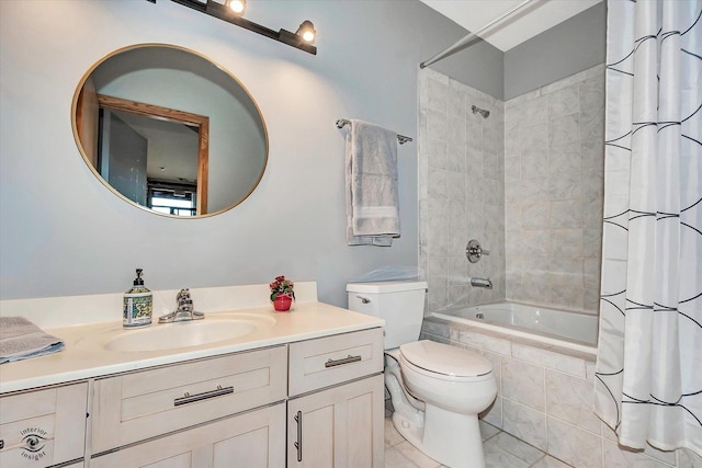 bathroom featuring tiled shower / bath combo, vanity, toilet, and tile patterned floors