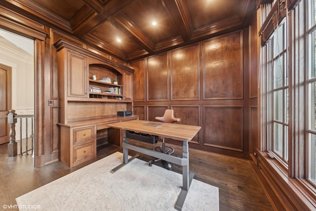 office space featuring coffered ceiling, ornamental molding, dark hardwood / wood-style flooring, and beam ceiling