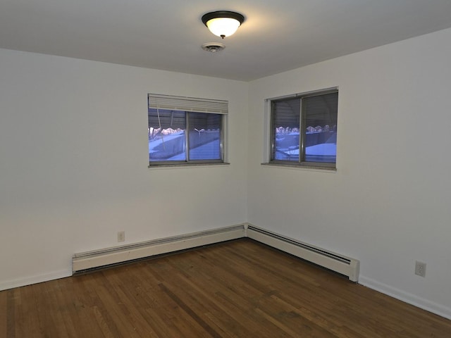 spare room featuring dark hardwood / wood-style flooring