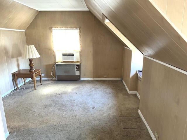 additional living space featuring carpet floors, cooling unit, vaulted ceiling, and baseboards