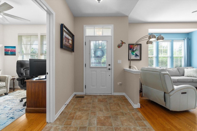 entryway featuring ceiling fan and wood-type flooring