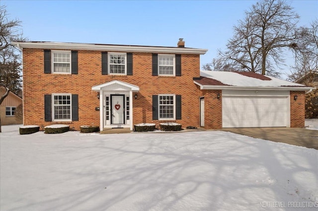 colonial inspired home with a garage