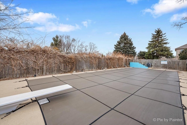 view of pool featuring fence