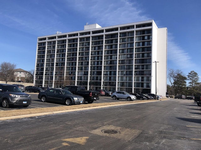 view of property featuring uncovered parking