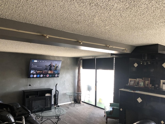 living room with carpet floors and a textured ceiling