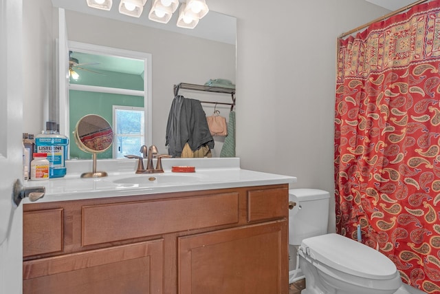 bathroom with vanity, ceiling fan, and toilet