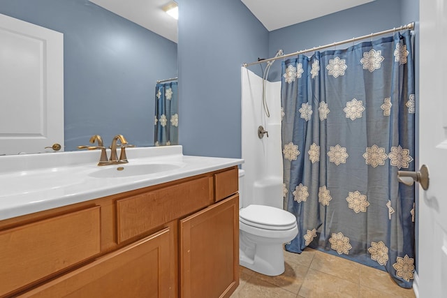 bathroom featuring vanity, walk in shower, tile patterned floors, and toilet