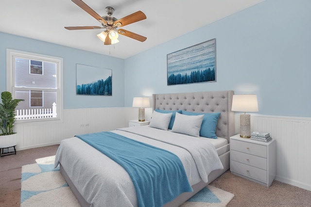 bedroom featuring ceiling fan and light carpet