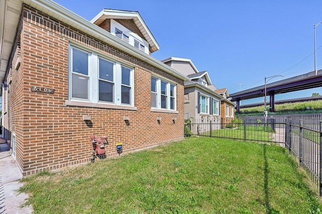 view of property exterior with a lawn