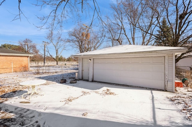 view of snow covered garage