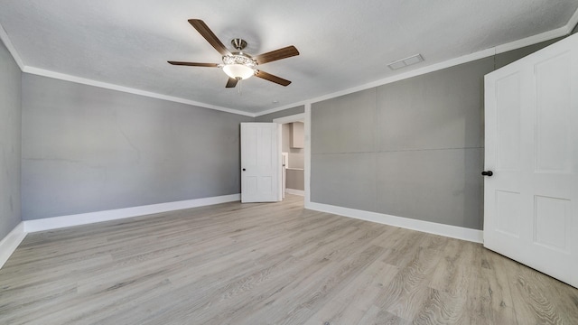 empty room featuring crown molding, a textured ceiling, ceiling fan, and light wood-type flooring