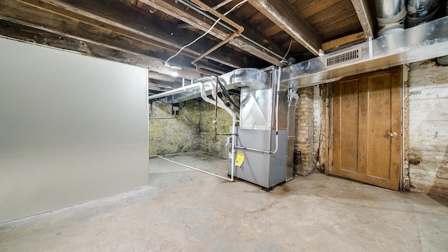 basement featuring heating unit