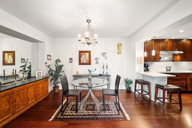 dining space featuring recessed lighting, dark wood finished floors, baseboards, and an inviting chandelier