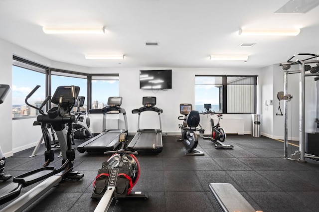 gym featuring visible vents and baseboards