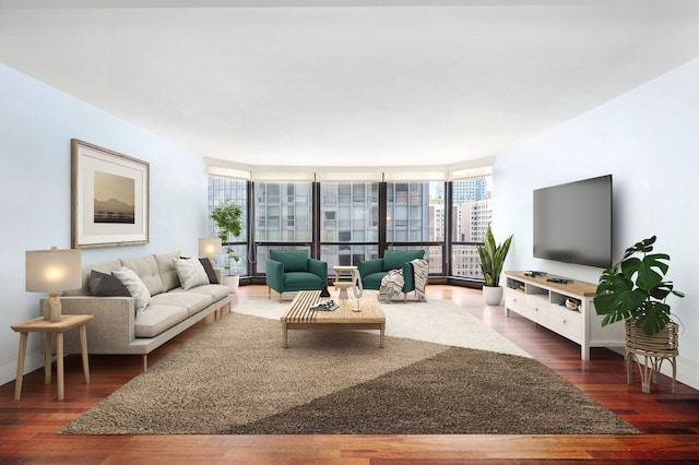 living room with expansive windows, baseboards, and wood finished floors