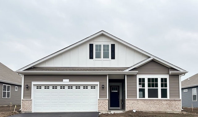 craftsman house with a garage