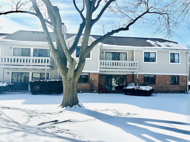 view of front of property with a balcony