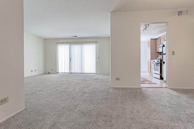 empty room featuring light carpet