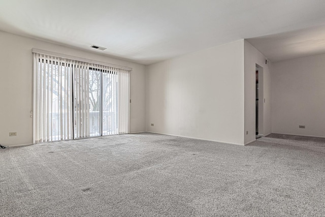 unfurnished room featuring carpet