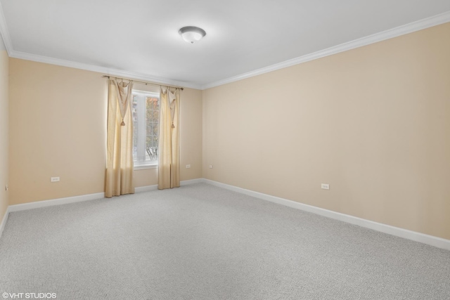 carpeted empty room featuring ornamental molding