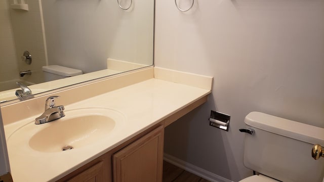 full bathroom with vanity, shower / washtub combination, and toilet