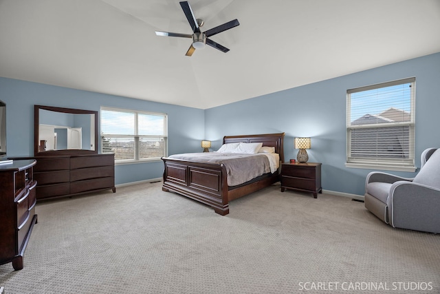 carpeted bedroom featuring lofted ceiling, a ceiling fan, and baseboards