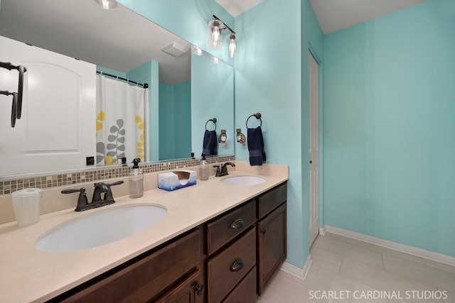 full bathroom with double vanity, tasteful backsplash, a sink, and visible vents