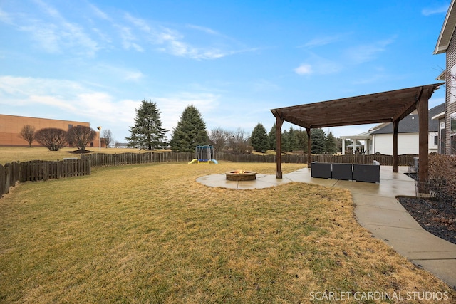 view of yard featuring a patio, a playground, a fenced backyard, a pergola, and an outdoor living space with a fire pit