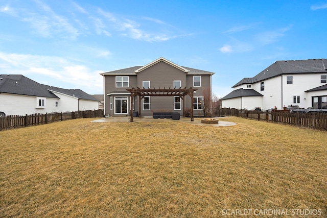 back of property with a patio area, an outdoor fire pit, a pergola, and a yard