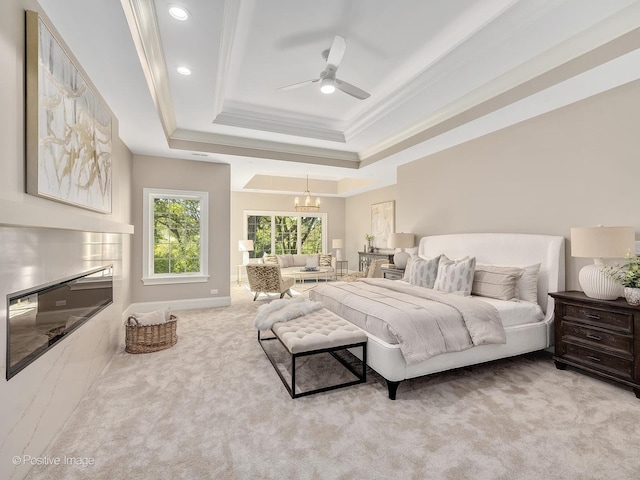 bedroom with crown molding, light colored carpet, a raised ceiling, and ceiling fan with notable chandelier