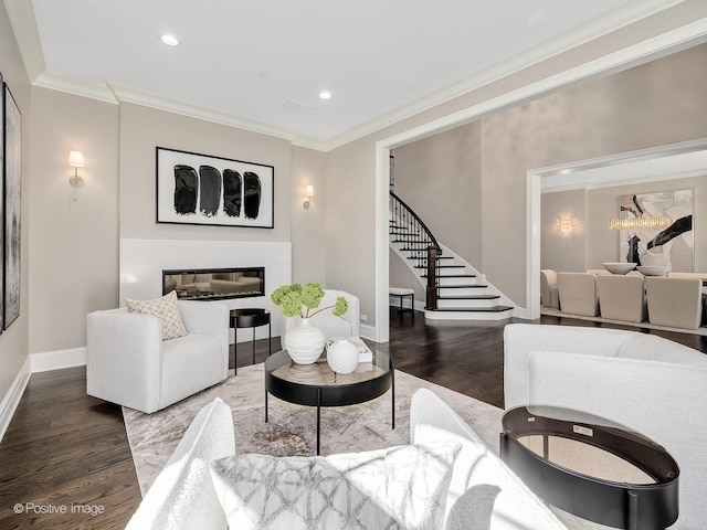 living room with hardwood / wood-style floors and crown molding