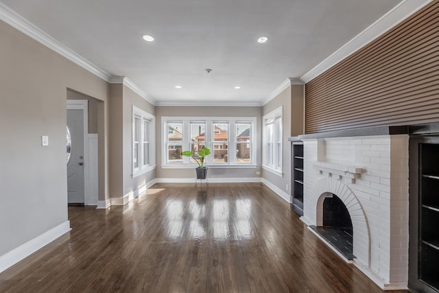 unfurnished living room featuring crown molding, dark hardwood / wood-style floors, and a brick fireplace