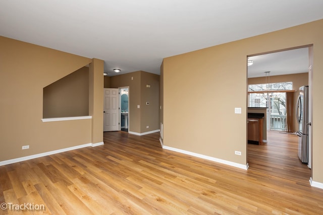 spare room featuring light hardwood / wood-style floors