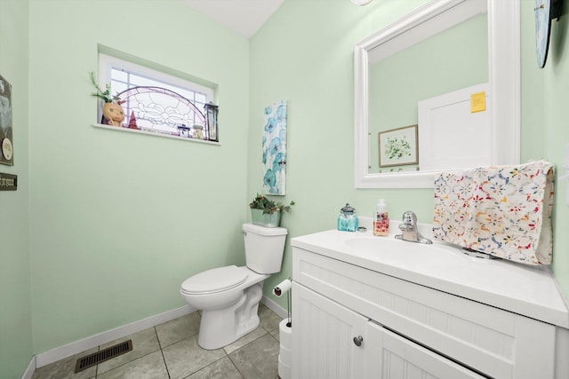 bathroom featuring tile patterned flooring, vanity, and toilet