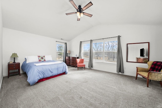 carpeted bedroom with ceiling fan and vaulted ceiling