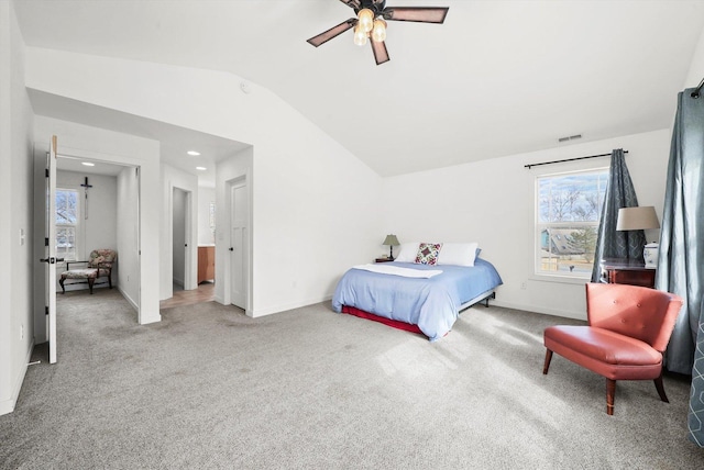 bedroom featuring vaulted ceiling, ceiling fan, and carpet flooring