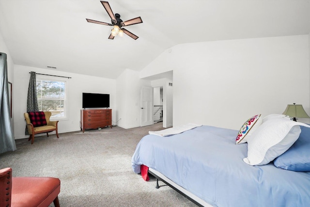 bedroom with ceiling fan, light colored carpet, and vaulted ceiling