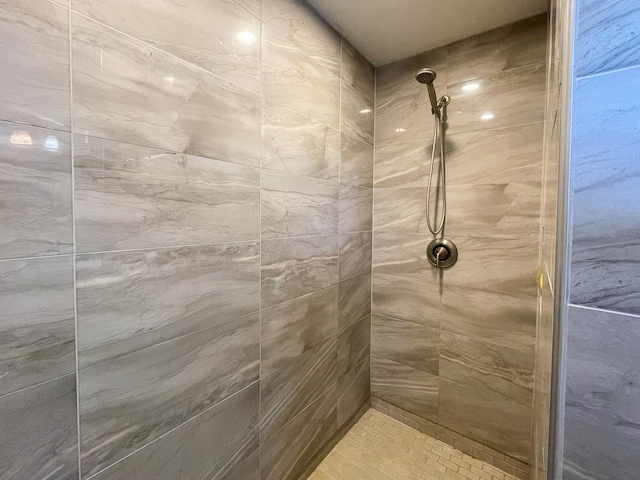 bathroom with a tile shower